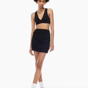 Ruched black mini skirt